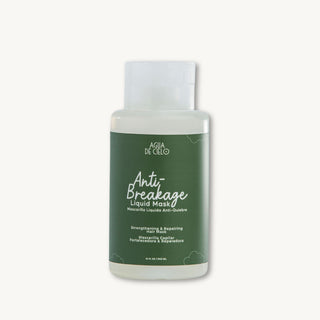 A bottle of AGUA DE CELO Anti-Breakage Liquid Mask for breakage repair with a dark green label and white cap, set against a solid off-white background.