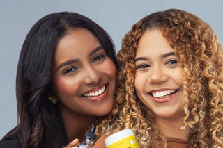 two women using anti frizz hair products by agua de cielo