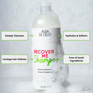 A 16 fl oz bottle of Agua DE CIELO Recover Me Shampoo surrounded by white foam, with four green-outlined callout boxes highlighting key benefits: 'Deeply Cleanses,' 'Hydrates & Softens,' 'Unclogs hair follicles,' and 'Free of harsh ingredients.'. Un champu sin sal