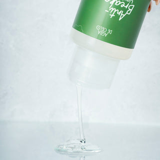 hair breakage treatment by agua de cielo with a green and white label on a light gray background