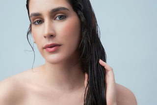 women with wet hair using hair products for split ends by agua de cielo