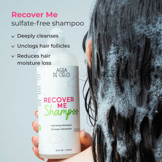 A hand holds a bottle of Agia de Cielo Recover Me Sulfate-Free Shampoo for hair recovery kit against a light gray background, with wet, soapy black hair on the right side of the frame and promotional text on the left.