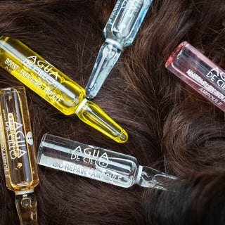 hair therapy complex 5 hair bonding treatment on a hair background